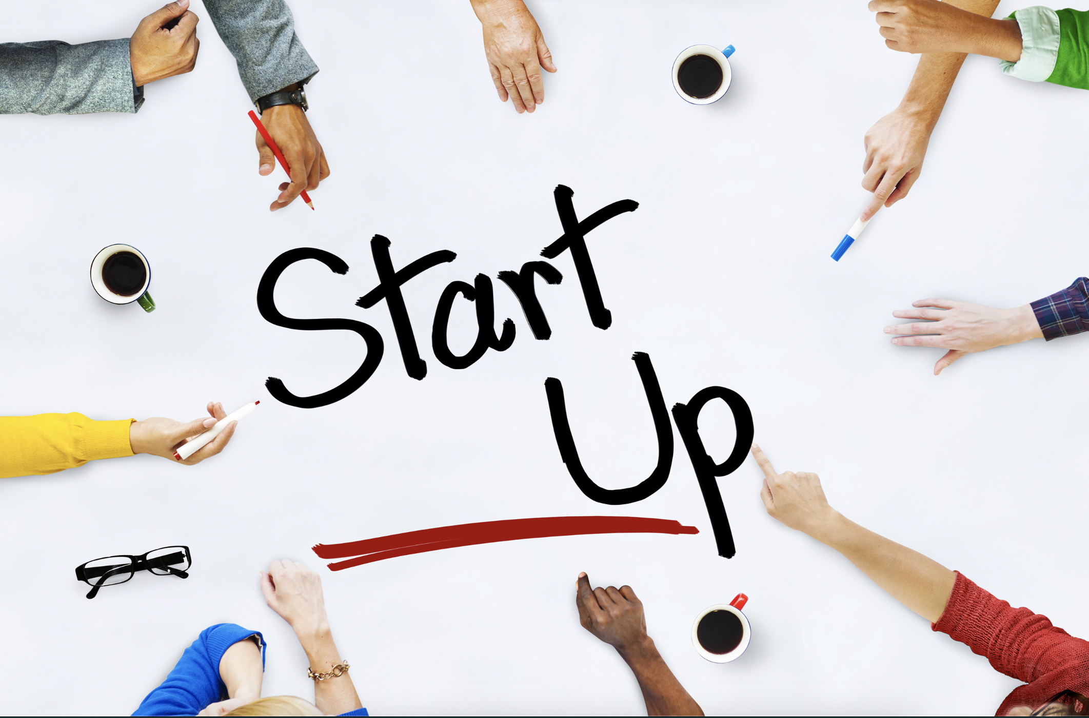 Different startups pointing towards the word startup